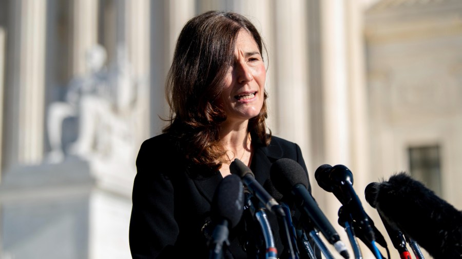 Julie Rikelman addresses the press outside the Supreme Court for oral arguments in Dobbs v. Jackson Women's Health in December.