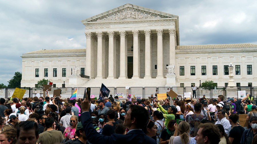 Protesters for abortion rights demonstrate outside the Supreme Court on Friday, June 24, 2022 after the court released a decision to strike Roe v. Wade.