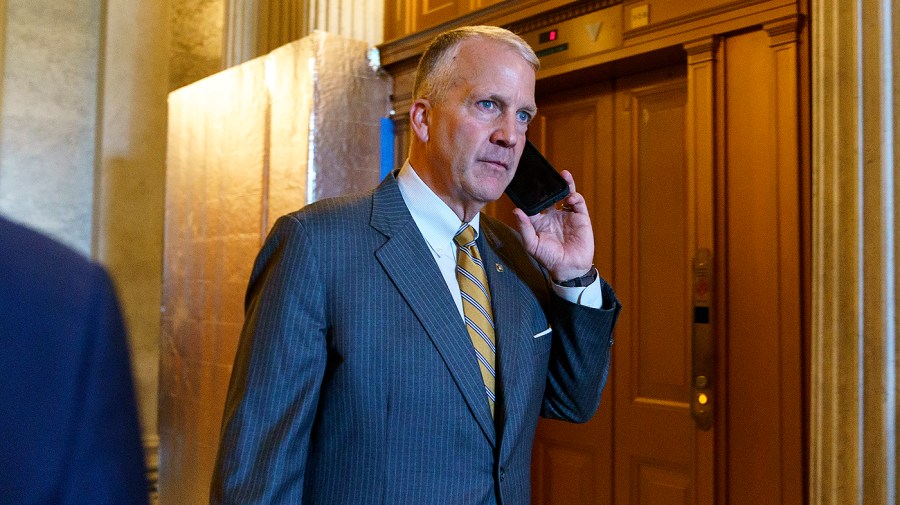 Sen. Dan Sullivan (R-Alaska) leaves the Senate Chamber following a procedural vote regarding the nomination of Julianna Michelle Childs to be United States Circuit Judge for Washington, D.C., on Thursday, July 14, 2022.