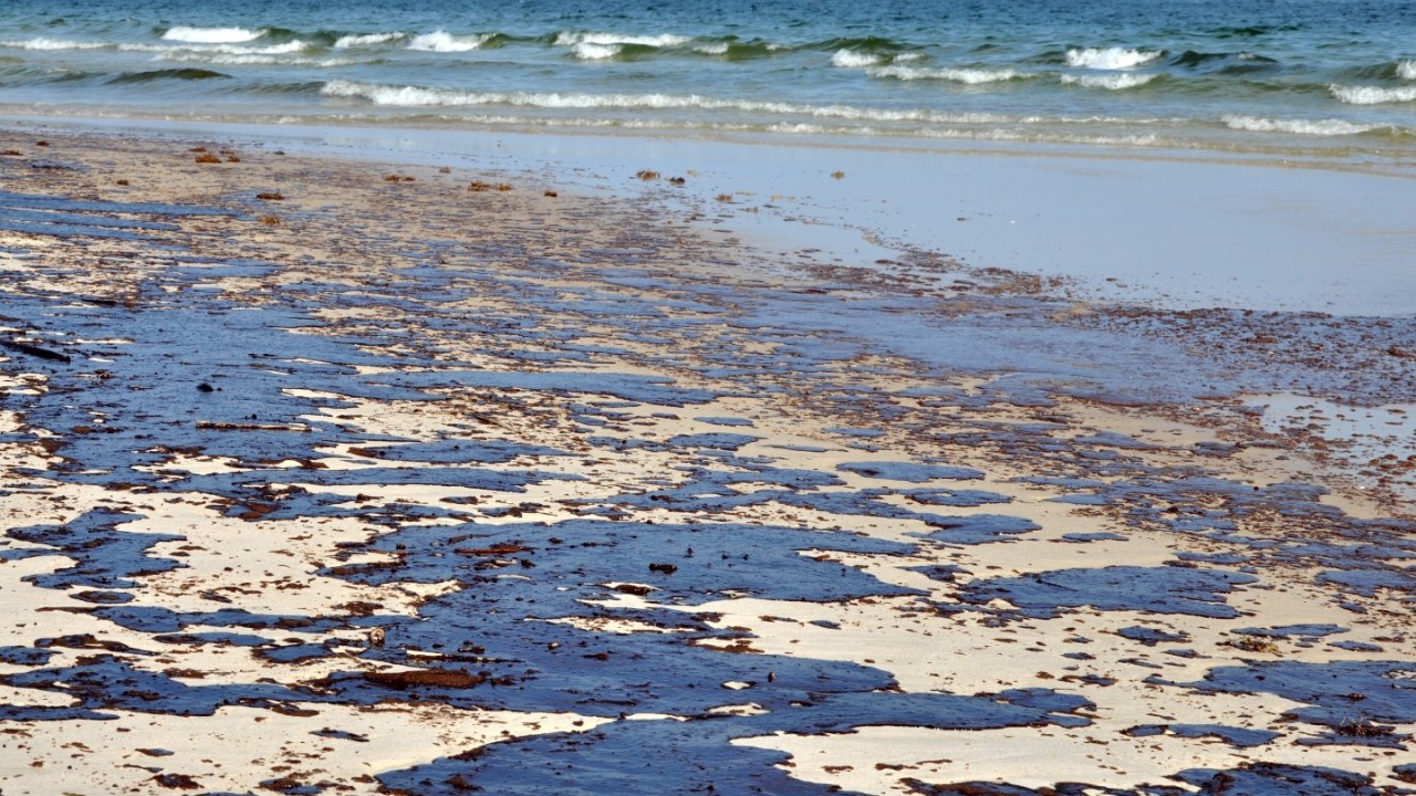 Oil on beach.