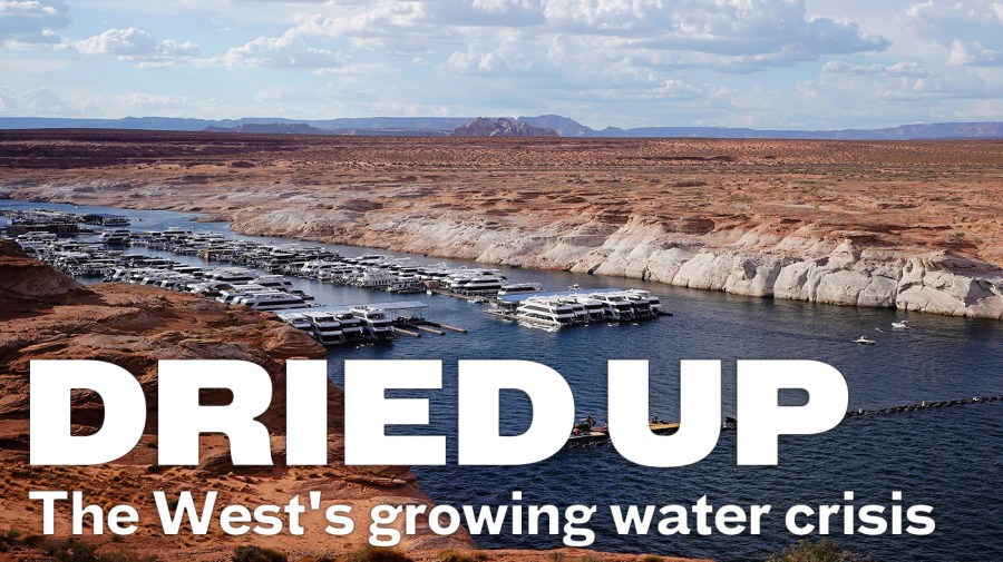 A white band of newly exposed rock is shown along the canyon walls at Lake Powell.