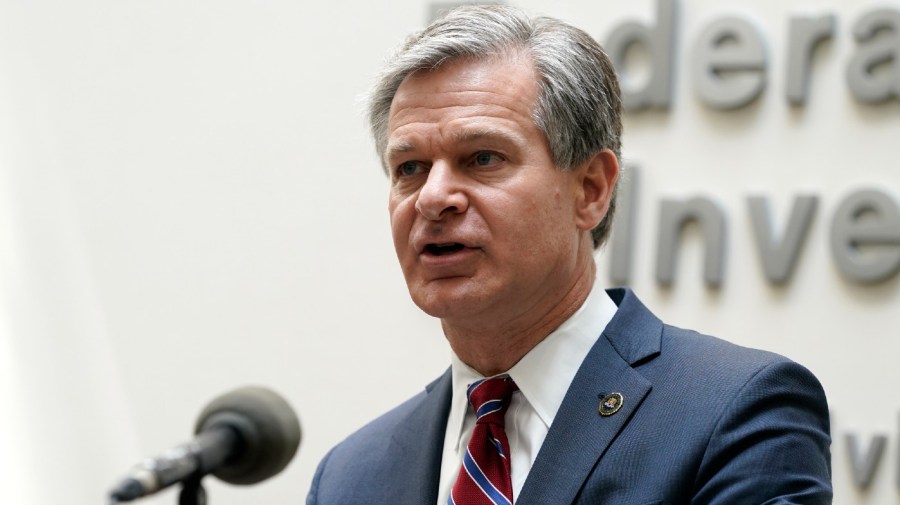 FBI Director Christopher Wray speaks during a news conference.