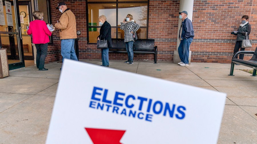 People line up to vote outside