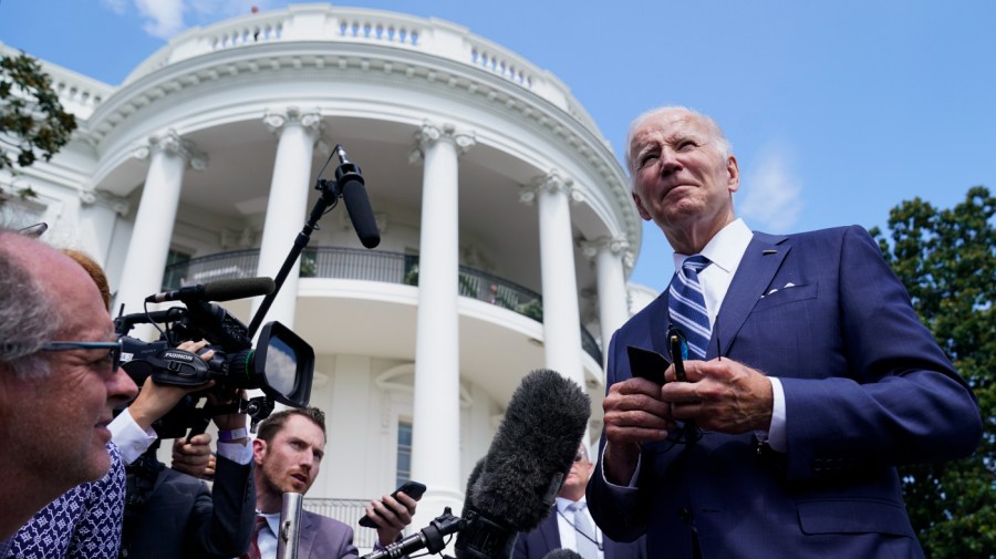 President Biden speaks with reporters outside the White House