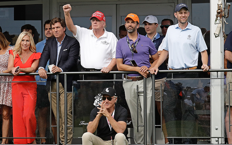 Rep. Marjorie Taylor Greene (R-Ga.), Tucker Carlson, former President Trump and his sons