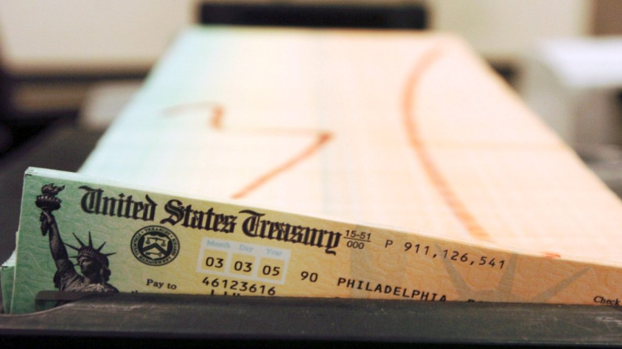 FILE - Trays of printed social security checks wait to be mailed from the U.S. Treasury's Financial Management services facility in Philadelphia on Feb. 11, 2005.