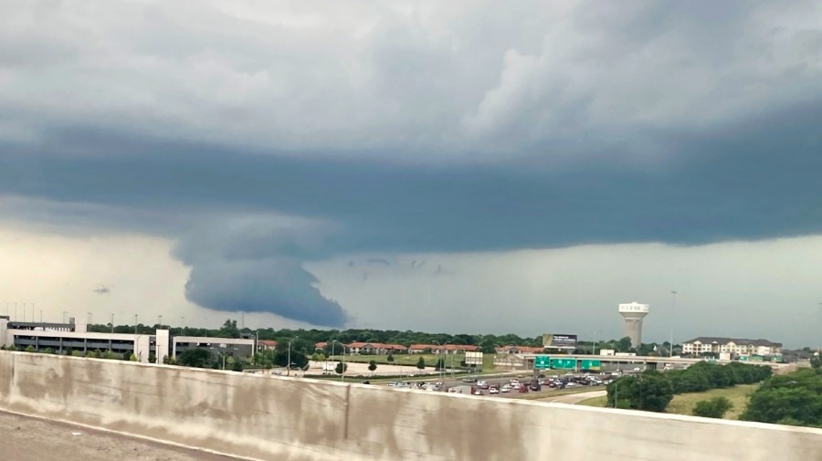 A formation drops from passing rain clouds over part of Fort Worth, Texas.