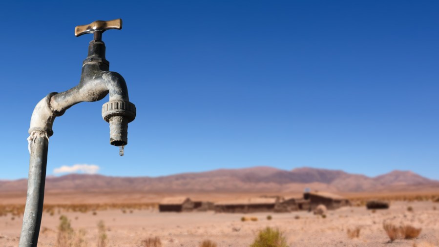 Drips faucet and dry environment in the background