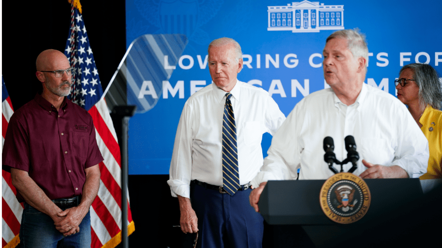 Agriculture Secretary Tom Vilsack speaks as President Joe Biden stands with Jeff O'Connor, owner of O'Connor Farms, left, and Rep. Robin Kelly, D-Ill., right, during a visit to O'Connor Farms, Wednesday, May 11, 2022, in Kankakee, Ill.