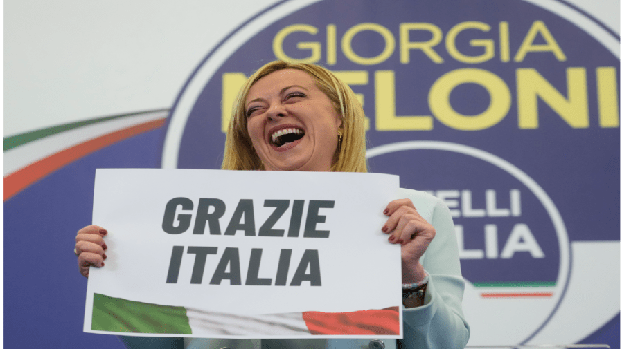 Far-Right party Brothers of Italy's leader Giorgia Meloni shows a placard reading in Italian "Thank you Italy" at her party's electoral headquarters in Rome, early Monday, Sept. 26, 2022.