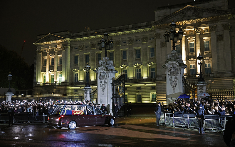 The hearse carrying the flag-draped casket of Queen Elizabeth II