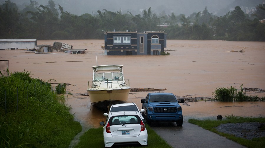 A home is submerged in floodwaters caused by Hurricane Fiona