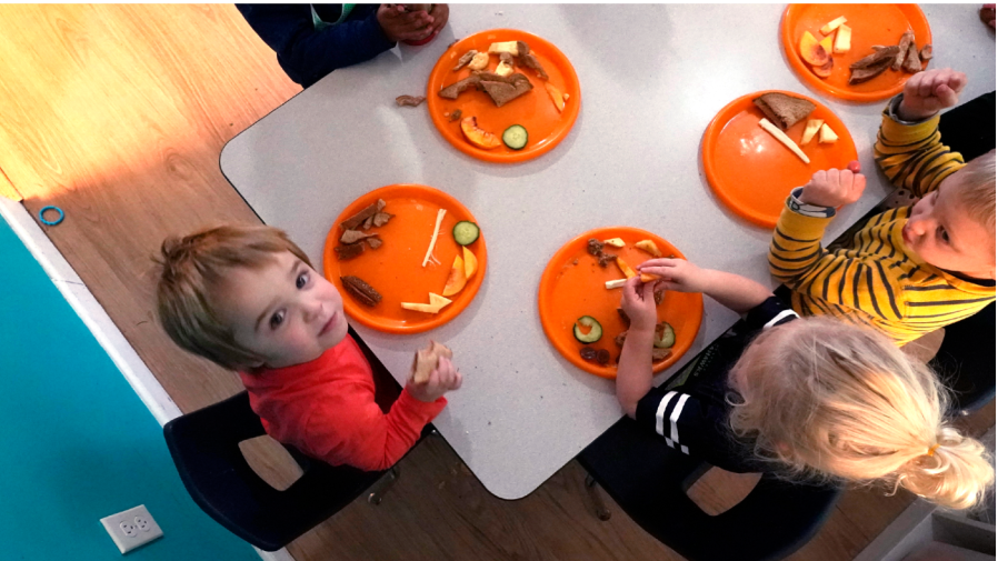 Preschool children eat lunch at a day care facility, Monday, Oct. 25, 2021, in Mountlake Terrace, Wash.