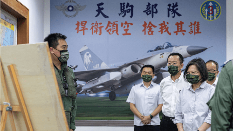 In this photo released by the Taiwan Ministry of National Defense, Taiwan's President Tsai Ing-wen, right, is briefed during a visit to a naval station on Penghu, an archipelago of several dozen islands off Taiwan's western coast on Tuesday, Aug. 30, 2022.