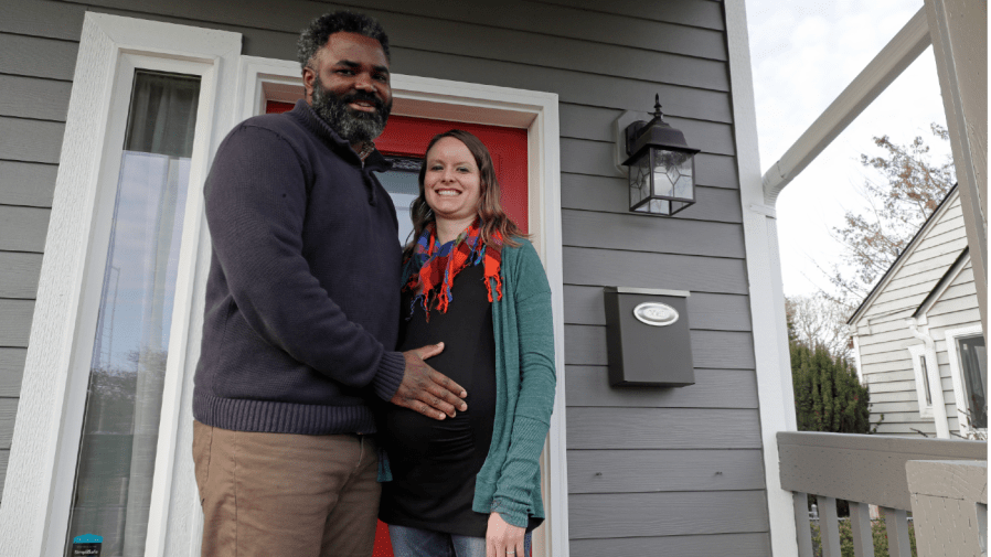 Kate and Quantas Ginn pose for a photo Sunday, Dec. 29, 2019 at their home in Tacoma, Wash.