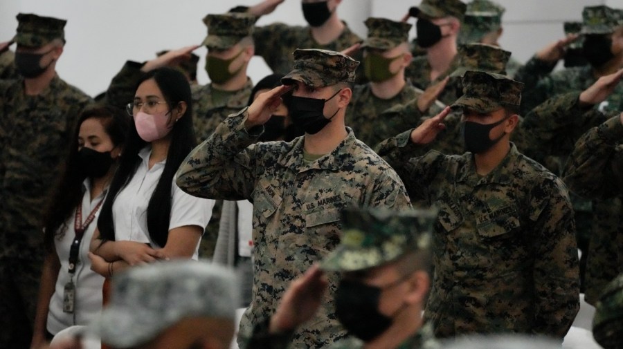 U.S. Marines salute during opening ceremonies of an annual joint military exercise