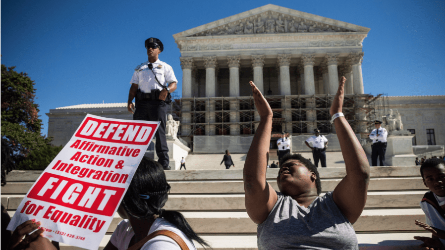 WASHINGTON, DC - OCTOBER 15: Students protest in support of affirmative action, outside the Supreme Court during the hearing of "Schuette v. Coalition to Defend Affirmative Action" on October 15, 2013 in Washington, DC.