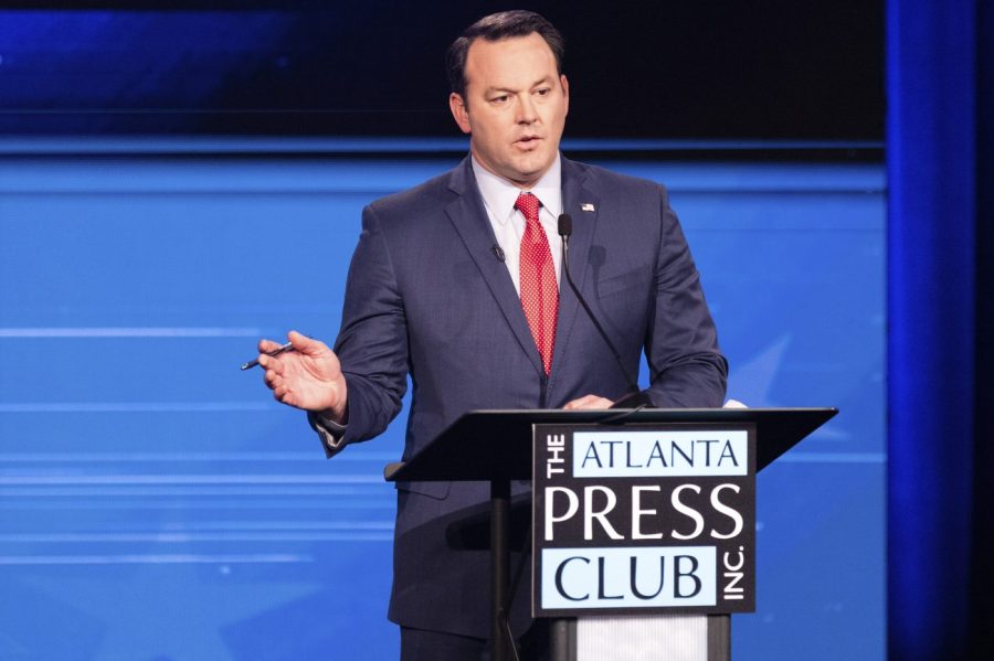 Then-state Sen. Burt Jones, Republican candidate for lieutenant governor of Georgia, participates in the Atlanta Press Club Loudermilk-Young Debate Series with Libertarian Ryan Graham and Democrat Charlie Bailey, Tuesday, Oct. 18, 2022, in Atlanta.