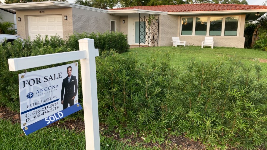 FILE - A home with a "Sold" sign is shown, Sunday, May 2, 2021, in Surfside, Fla.