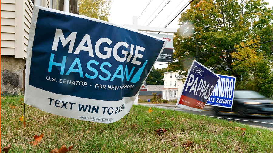 Signs for Sen. Maggie Hassan (D-N.H.) and Rep. Chris Pappas (D-N.H.) are seen in Manchester, N.H., on Monday, October 10, 2022.