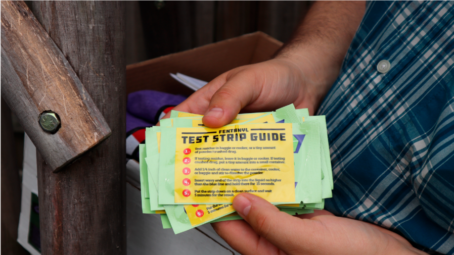 Organizers prepare packets for the third annual "Save a Life" day event at the Unitarian Universalist Congregation of Charleston in Charleston, W.Va., Tuesday, Sept. 6, 2022.