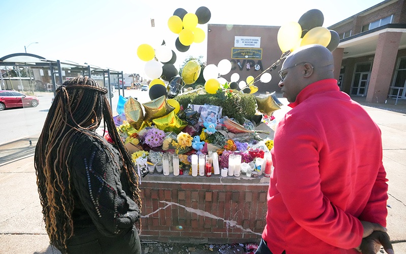 Reps. Cori Bush (D-Mo.) and Jamaal Bowman (D-N.Y.) look over a memorial