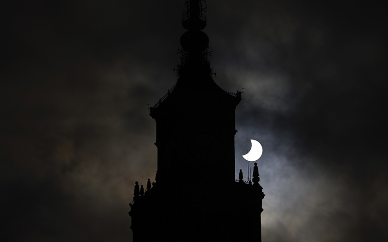 The sun is partially obscured by the moon during a solar eclipse