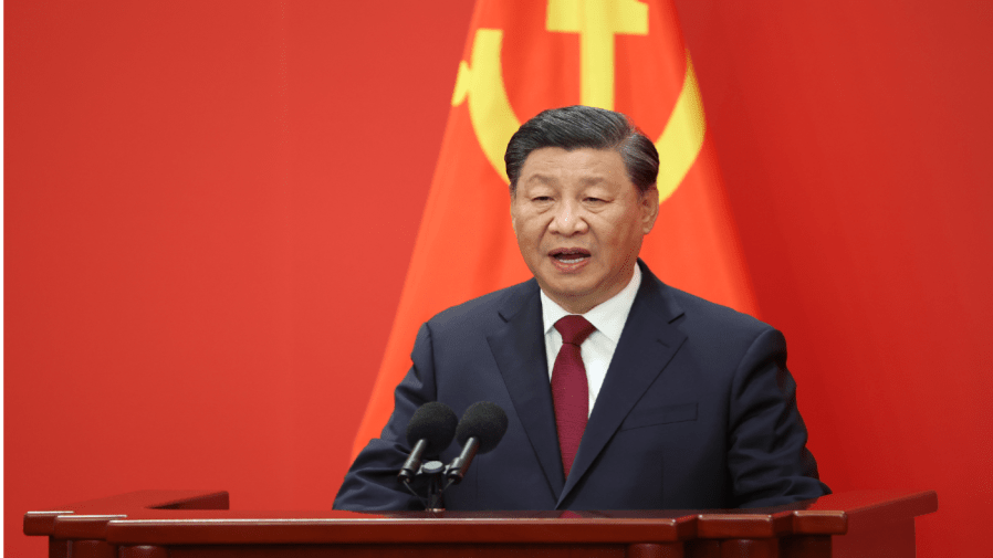 Chinese President Xi Jinping speaks at the podium during the meeting between members of the standing committee of the Political Bureau of the 20th CPC Central Committee and Chinese and foreign journalists at The Great Hall of People on October 23, 2022 in Beijing, China.