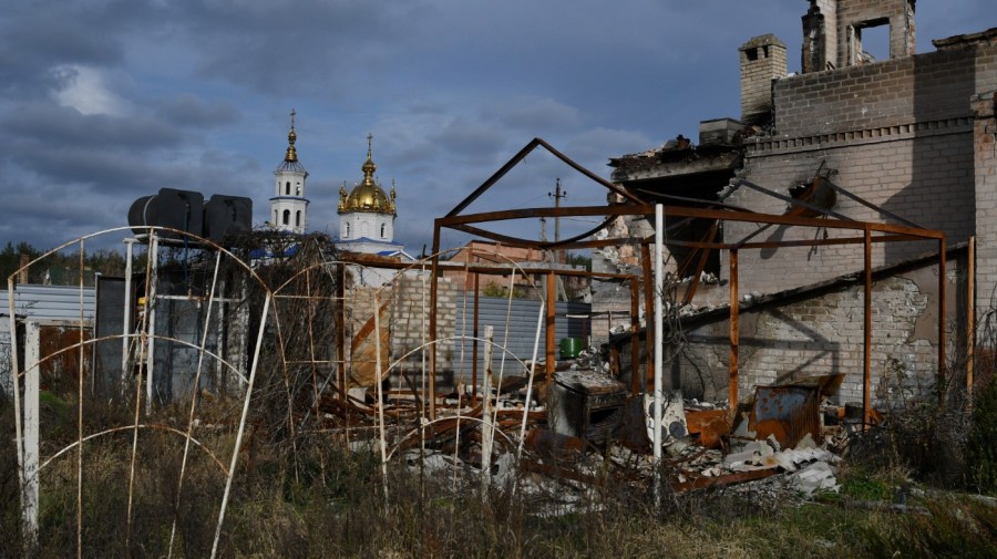 A view of buildings damaged by shelling with an Orthodox Church in the background in the liberated village of Shchurove, Donetsk region, Ukraine