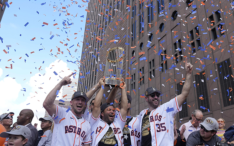 Houston Astros players celebrate during a victory parade