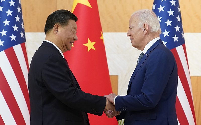 Chinese President Xi Jinping and President Biden shake hands