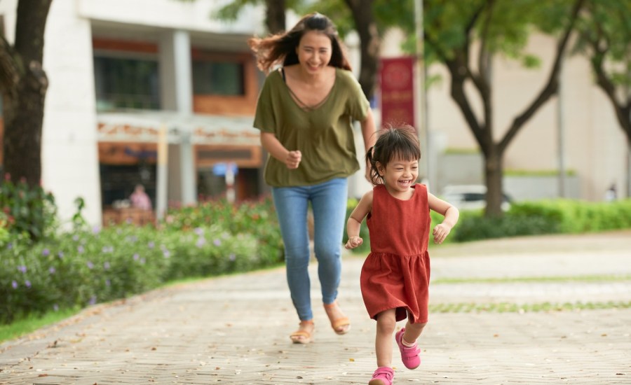 Mother running to catch daughter.