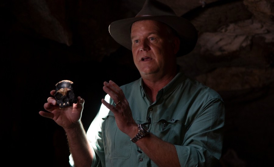 Professor Lee Berger holds a replica of the discovered Homo Naledi fossil inside the Rising Star Cave in the Cradle of Humankind World Heritage Site near Johannesburg, Thursday, Nov. 4, 2021.