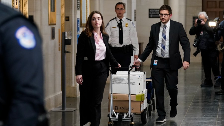 Documents arrive as the House Ways & Means Committee holds a hearing regarding tax returns from former President Donald Trump on Capitol Hill in Washington, Tuesday, Dec. 20, 2022.