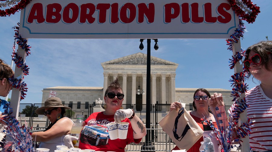 Abortion-rights activists setup an abortion pills educational booth