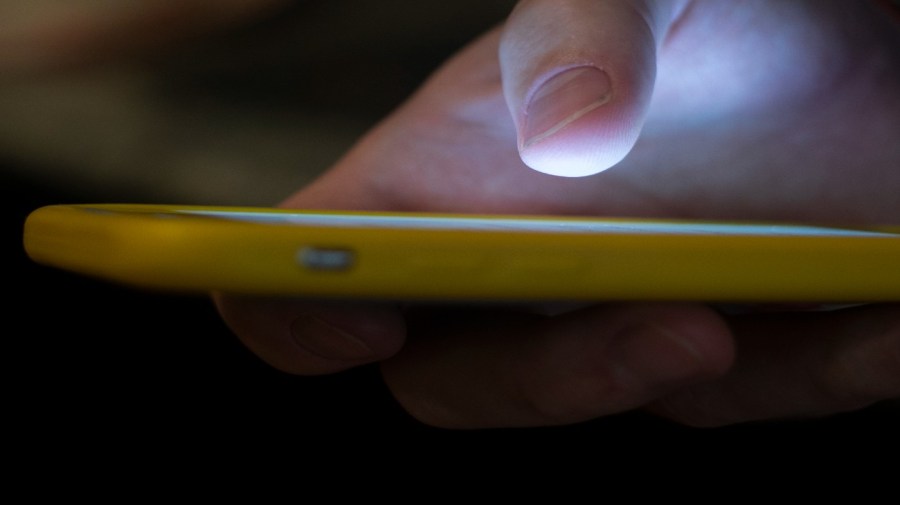 In this Aug. 11, 2019, file photo, a man uses a cellphone in New Orleans.