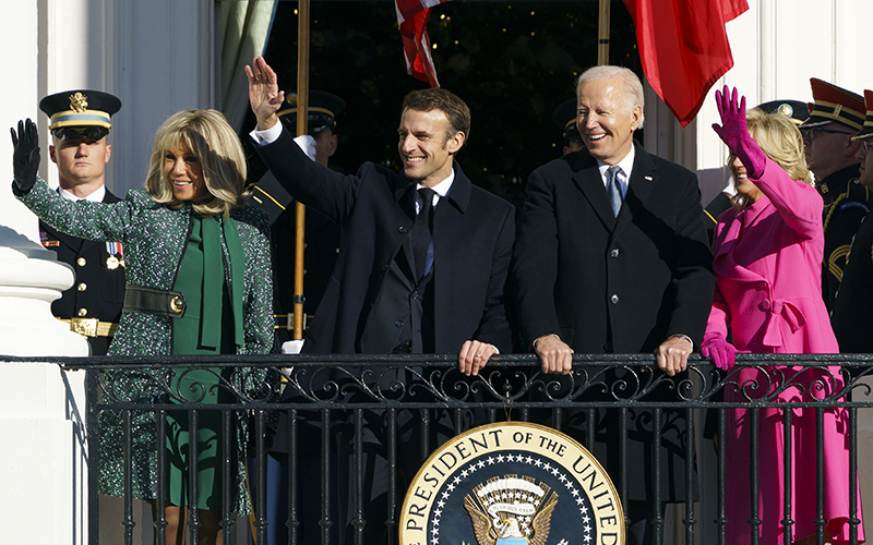 French first lady Brigitte Macron, French President Emmanuel Macron, President Biden and first lady Jill Biden wave to spectators