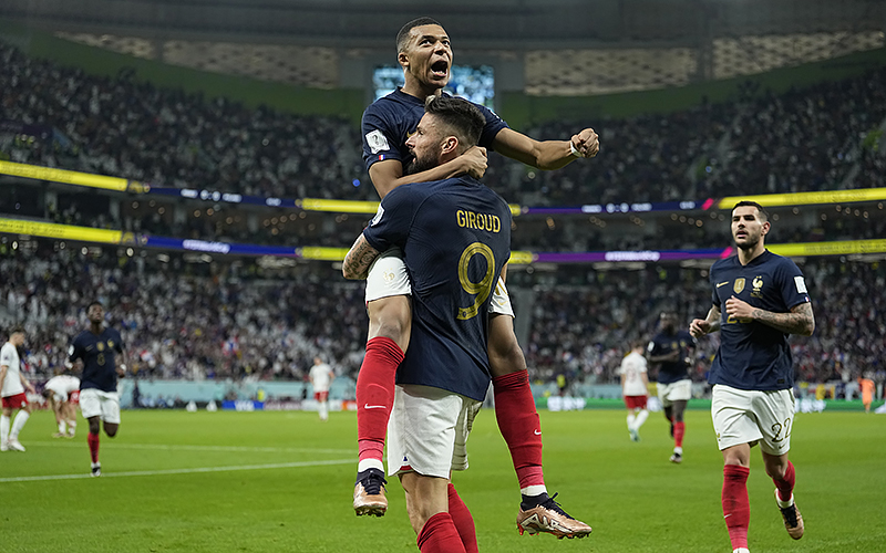 France's Olivier Giroud celebrates with France's Kylian Mbappe