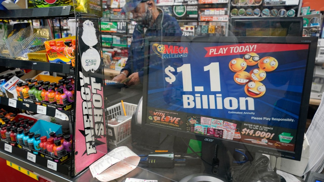 Sign displays $1.1 billion Mega Millions jackpot.