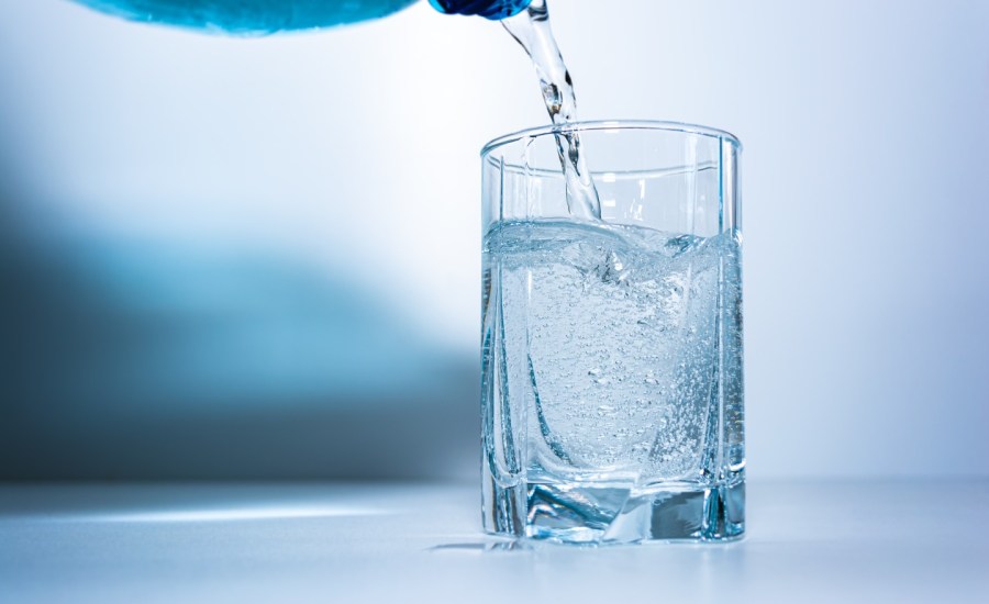 Pouring water in glass.