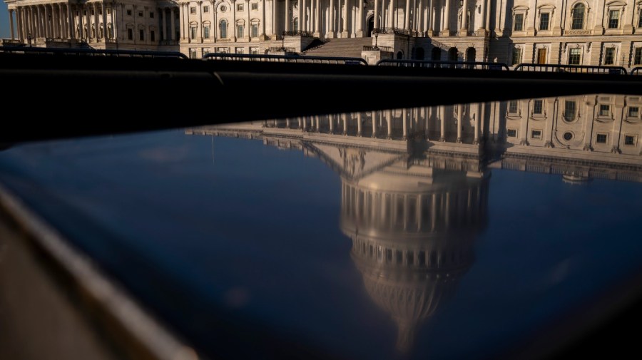 The Dome of the U.S. Capitol Building is visible in a reflection on Capitol Hill in Washington, Monday, Jan. 23, 2023. (AP Photo/Andrew Harnik)