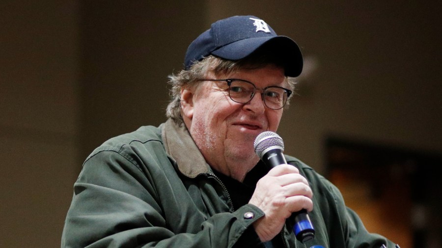 Filmmaker Michael Moore speaks at at a rally.