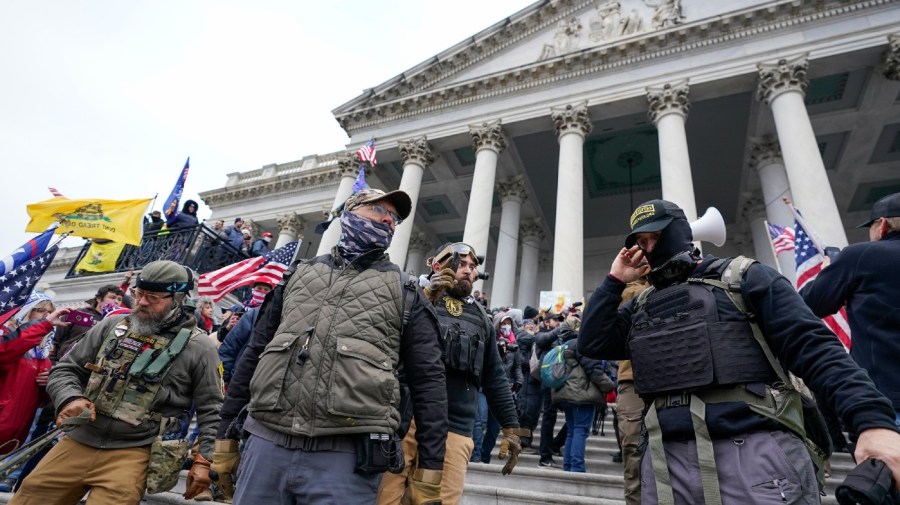 FILE - Members of the Oath Keepers extremist group stand on the East Front of the U.S. Capitol on Jan. 6, 2021, in Washington. The Capitol riot was the culmination of weeks of preparation and a moment of triumph for the Oath Keepers, federal prosecutor Louis Manzo said Jan. 18, 2023, in closing arguments in the second seditious conspiracy trial against members of the far-right extremist group. The defendants facing jurors in the latest trial are Joseph Hackett, Roberto Minuta, David Moerschel, and Edward Vallejo. (AP Photo/Manuel Balce Ceneta, File)