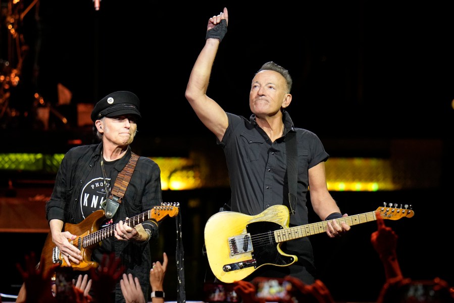 Singer Bruce Springsteen, right, and E Street Band member Nils Lofgren perform