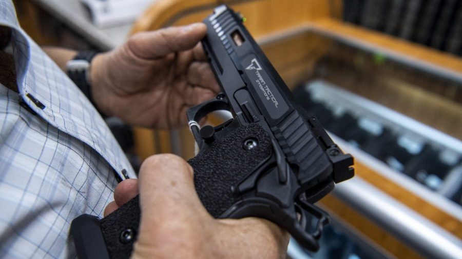 A customer checks out a hand gun