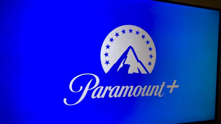 A screen displays the blue Paramount+ streaming platform logo.