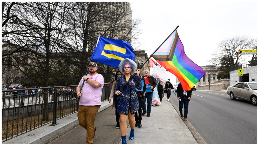 Trans rights activists march past the Tennessee state capitol