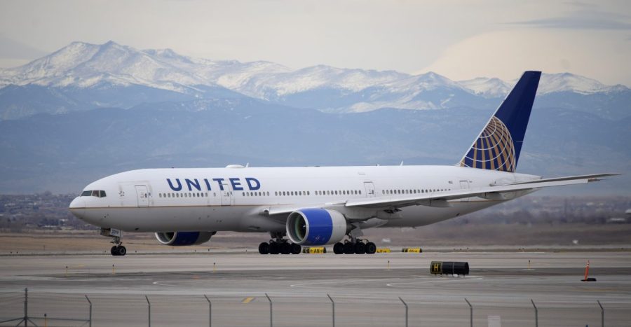 A United Airlines jetliner taxis to a runway for takeoff