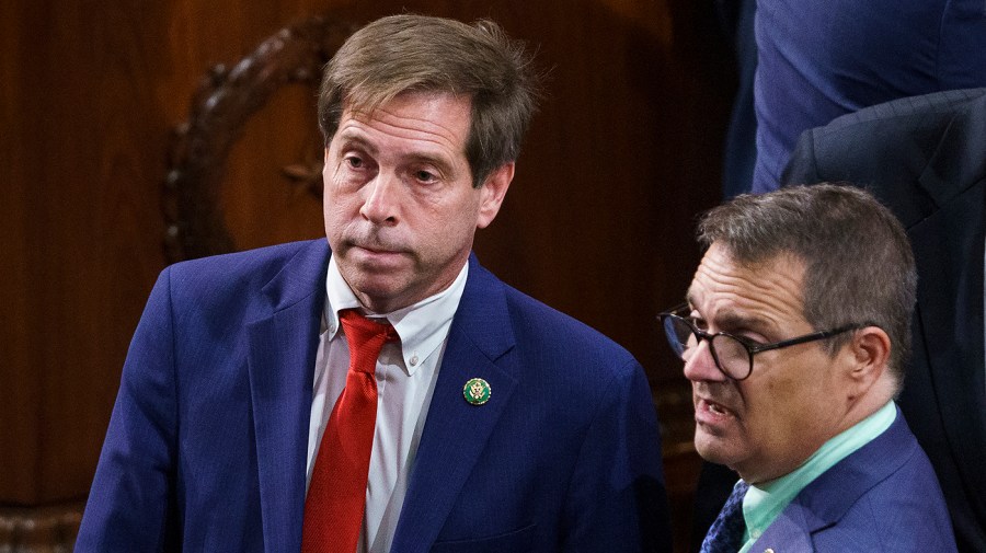 Rep. Chuck Fleischmann (R-Tenn.) listens to Rep. Gus Bilirakis (R-Fla.)