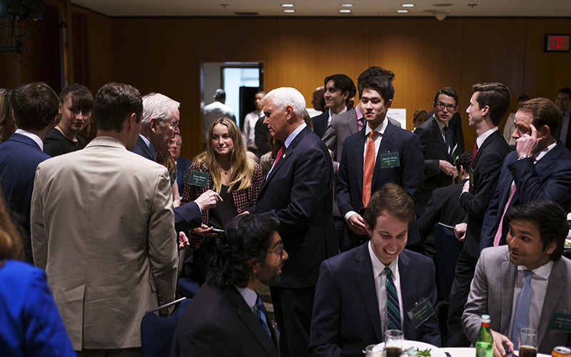 Former Vice President Mike Pence greets guests before a luncheon